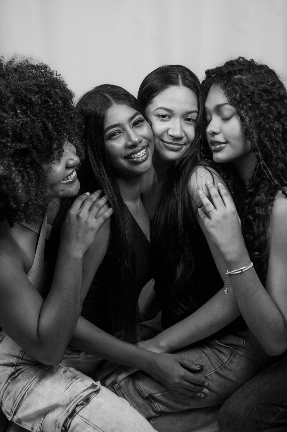 A group of women together, close and smiling